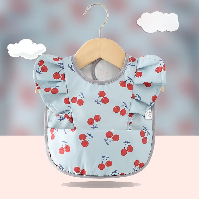 Bavoir imperméable anti-salissures , manches à volants