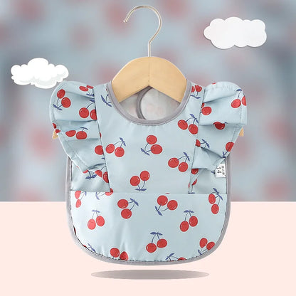 Bavoir imperméable anti-salissures , manches à volants